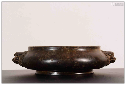 A CHINESE BRONZE CENSER WITH LION HANDLE…