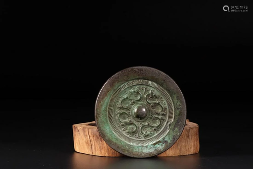 A CHINESE ARCHAIC BRONZE MIRROR, HAN DYN…