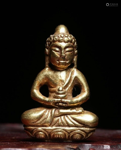 A CHINESE GOLD FIGURE OF BUDDHA SAKYAM…