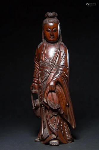 A CHINESE BOXWOOD FIGURE OF GUA…