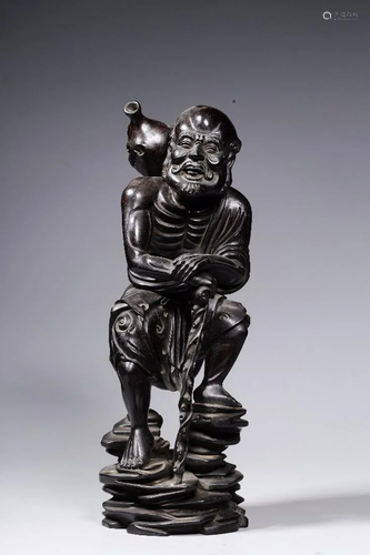 A CHINESE ZITAN WOOD FIGURE OF IMMORTAL…