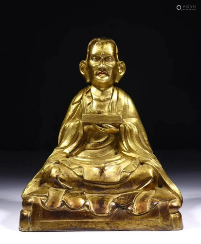 A CHINESE GILT-BRONZE FIGURE OF TSONGK…