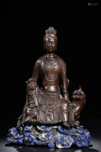 A CHINESE ALOESWOOD FIGURE OF GU…