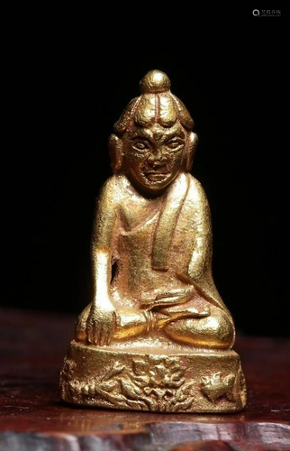 A CHINESE GOLD FIGURE OF BUDDHA SAKYAM…