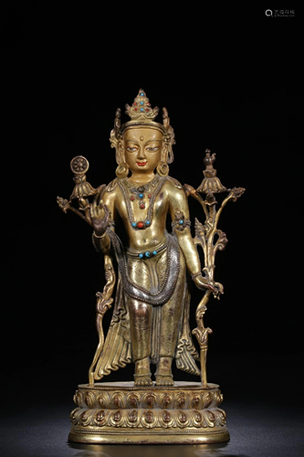 A CHINESE GILT-BRONZE FIGURE OF TARA, QI…