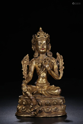 A CHINESE GILT-BRONZE SEATED FIGURE OF …