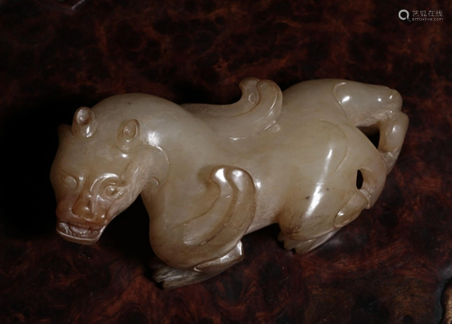 A CHINESE FINE WHITE JADE MYTHICAL BEAST…