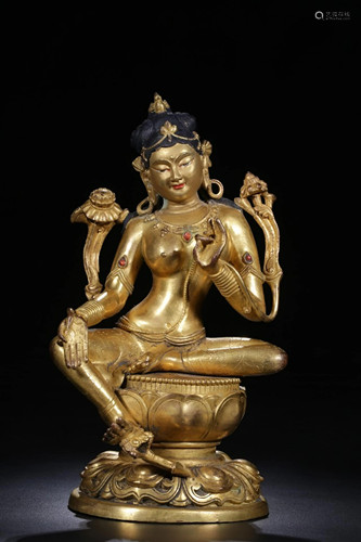 A CHINESE GILT-BRONZE FIGURE OF GREEN T…