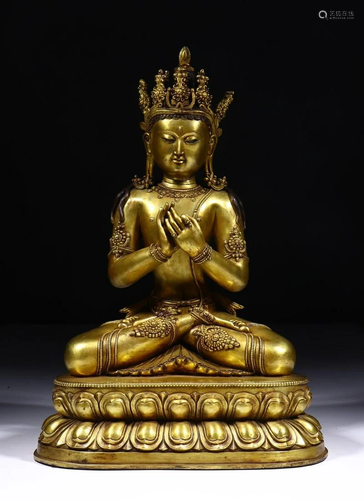 A CHINESE GILT-BRONZE FIGURE OF MANJUS…