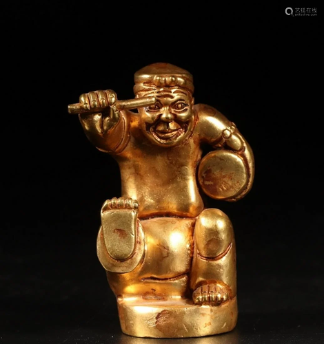 A CHINESE GILT-BRONZE FIGURE OF A DRUM…