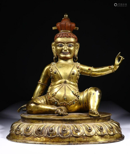 A CHINESE GILT-BRONZE FIGURE OF VIRUPA, …