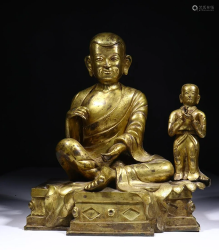 A CHINESE GILT-BRONZE FIGURE OF ARHAT, …