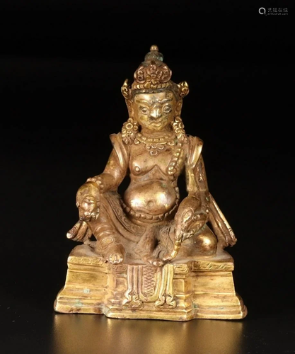 A CHINESE GILT-BRONZE FIGURE OF YELLOW …