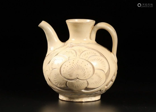 A CHINESE YAOZHOU CELADON CARVED â€˜FLORA…