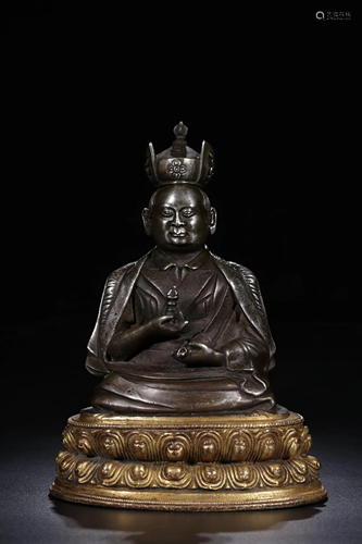 A CHINESE GILT-BRONZE FIGURE OF GURU, Q…