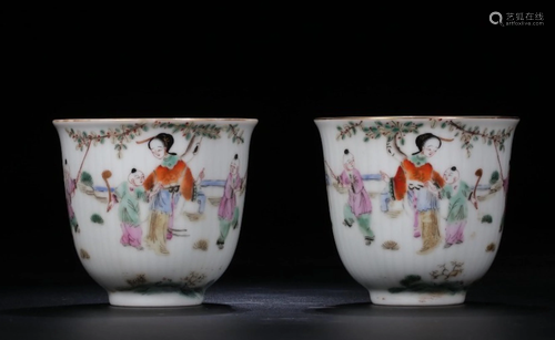 A PAIR OF CHINESE FAMILLE ROSE CUPS WITH TO…