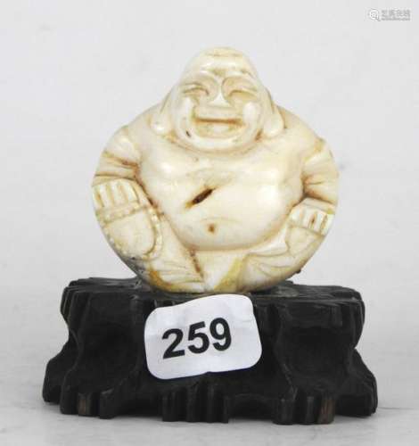 CHINE : Bouddha en ivoire sculpté. Sur socle en bo…