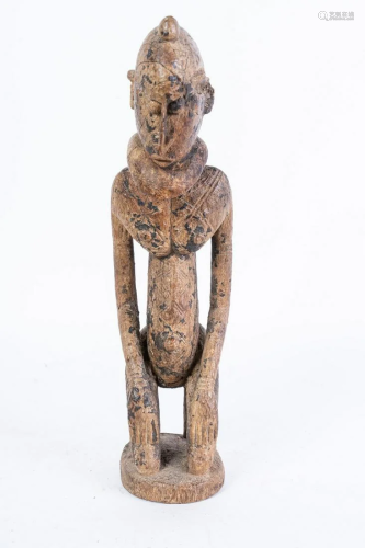 Arte africana Nommo kneeling figure, DogonMali .