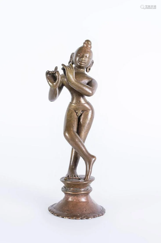 Arte Indiana A bronze figure of Krishna playing the