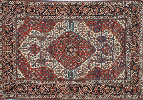 Arte Islamica A Persian rug decorated with flowers and