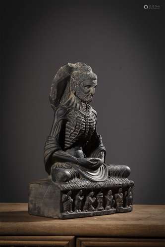 A Chinese Carved Stone Figure of Buddha