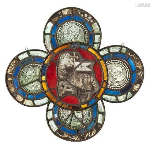 Stained glass window with Lamb of God. Probably France, around 1400. 50 x 50.5 cm. Four-fit. Colourless glass with black enamel painting, blue, red and yellow glass. Central representation of the Lamb of God, in the side fields busts or dog and mythical creature. Additions, partially rest. and best., lead frame renewed. Provenance: For several generations in a German private collection.