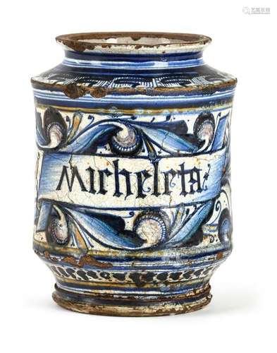 Formerly Albarello majolica. Faenza, 15th century. H. 19 cm. Majolica, white glazed and painted in blue, ochre and manganese. Cartouche with medical inscription on the front, floral tail on the reverse. cracks, chips, chipped glaze. Provenance: From old South German private property.