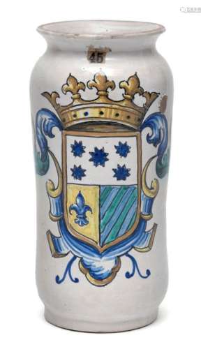 Albarello with count's coat of arms. Italy, 18th century. H. 26 cm. Majolica, white glazed, painted in the hottest colours yellow, blue and green. Crest with crown and tail. Old collection label 