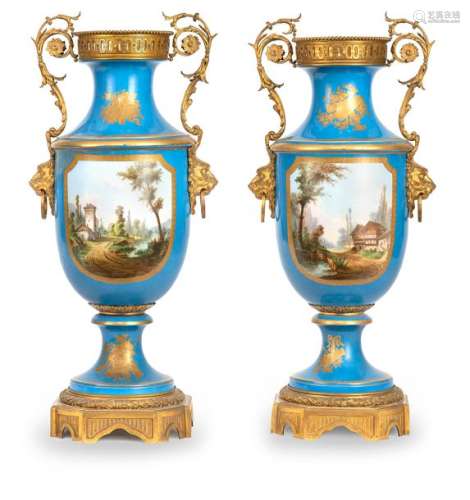 Pair of magnificent Louis XVI style floor vases. France, Sèvres, mid 19th century. H. 103 cm. Baluster vases with turquoise blue background. Large gold-framed cartouches on both sides with gallant, figural scenes in rococo style in park landscapes, landscapes with architecture on the reverse. Rich, gold etched decoration. Elaborate bronze mounting. At the bottom of one vase red stamp of the Château de Dreux, the other vase at the bottom closed with a wooden board and restored. Rubbed. Provenance: Stuttgart private collection. Purchased in 1993 from Dr. Fritz Nagel, auction 347, lot 386.