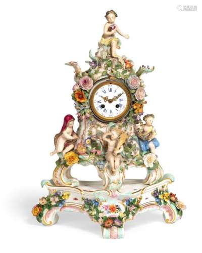 Magnificent pendule with base. Meissen, c. 1860/80. H. 48/60 cm. Magnificent case with 4 putti as seasons on the three rocaille feet and as a crowning. Around the dial and between the putti rich decoration of applied floral branches. Painting of scattered flowers and decorative gilding. Corresponding tripartite base underglaze blue sword mark, model no. 2172. partially l. rest, minor bumps. Provenance: Collection of the Stuttgart entrepreneur and art lover Wolfgang Osterloh.  See the portrait of Wolfgang Osterloh (PDF).
