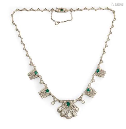 Fine art deco necklace. German, 1920s. L. 44 cm. Handmade. Movable limbs in 14kt white gold (585), completely set with 142 diamonds (approx. 6.7 ct./w, if-vvsi), the showpieces in geometrical and shell-like form. At the clasp a Carré emerald, the showpieces are set with 5 pentagonal to hexagonal emeralds of beautiful quality in fantasy cut. Emeralds add approx. 3 ct. Total weight approx. 34.5 gr. Provenance: Single copy made by a German goldsmith in the 1920s. Still owned by the family today.