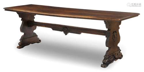 Large refectory table. Italian Renaissance style, 19th century. 81x250x77 cm. Side table with continuous central strut. Cartridges carved with dolphins on the cheeks. Walnut. Rest. Alterssp. Cf. F. Schottmüller, Wohnungskultur und Möbel der Italienischen Renaissance, p. 144.