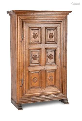 Early baroque cabinet. West German, 18th century. 180x117x53 cm. One-door. Iron mountings. Rest. Age-spangled oak, carved. Skid feet.