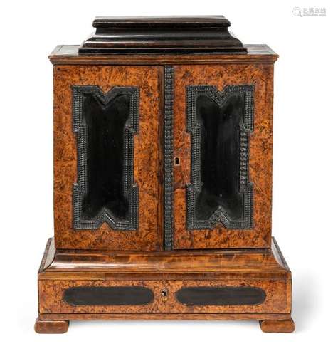 Baroque Cabinet. German, 18th century. 62x50x33 cm. Plinth thrust. Two doors in front of an interior with thirteen drawers and one door compartment. Root burl, partially ebonized. Rest. Erg. Aged. Provenance: From a large southern German private collection.