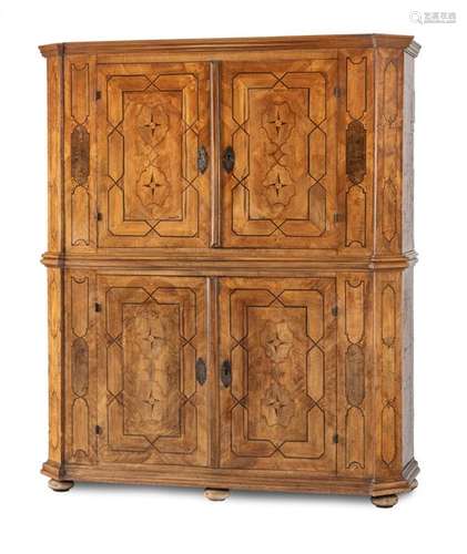 Baroque double locker. South German, circa 1740. 215x185x65 cm. Two-piece construction. Four doors. Iron mountings. Orig. blued straps and locks. Rest. Age-sp. walnut, bog oak, plum and others