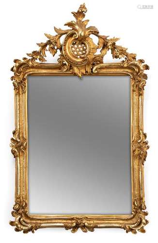 Magnificent mirror. Rococo style, 19th century. 121x75 cm. Stuccoed and gilded, partly silver-plated and gold-plated. Rest. Aged facetted mirror glass.