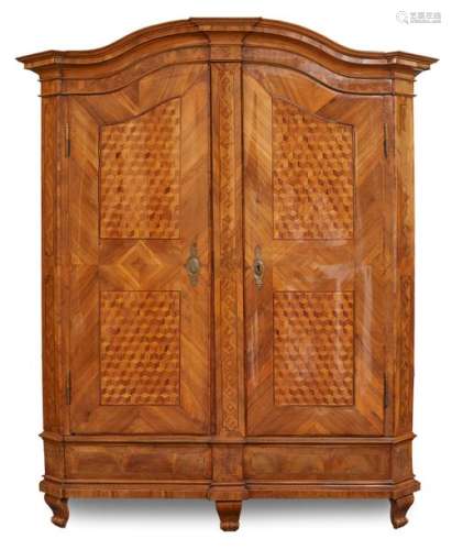 Elegant baroque cabinet. Württemberg, c. 1770. 230x190x65 cm. Two doors. Curved gable. Profiled base zone. Angled corner pilasters. Impact bar as pilaster. Orig. brass fittings and lock. Walnut and mahogany. Rest. The cabinet is illustrated and described in U. Dobler, Baroque Furniture, p. 145, no. 144.
