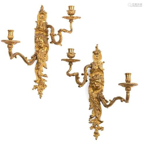 Pair of Regence chandelier appliqués. France, 18th century. H. 42 cm. Two-flame. Chased bronze, gilded. Rest. Age and use damage, traces of subsequent electrif. An almost identical pair of these so-called 