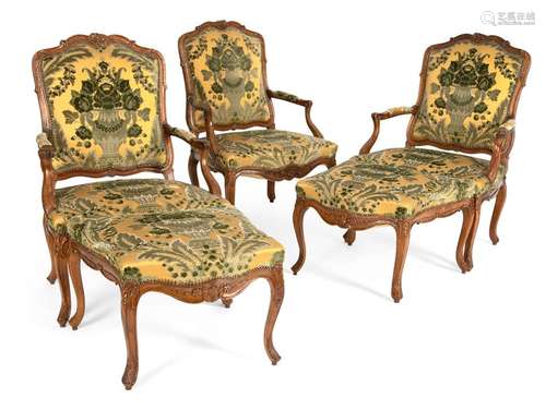 Three armchairs and two tabourets. Louis XV style. H. 44/96 cm. Carved. Walnut. Provenance: Private collection Baden-Württemberg.