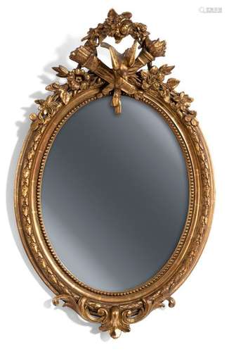 Wall mirror in classicist style. France, 19th century. H. 85 cm. Stuccoed and gilded. Rest. geriatric sp.