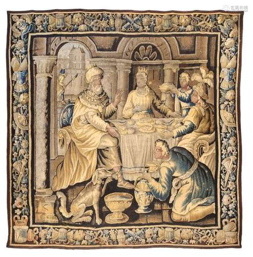 Aubusson tapestry. France, second half of the 17th century. Pairx 283 cm. Fine pictorial work in wool and silk with a square picture field. It depicts a solemn table scene in a hall with a royal couple in fine garments enthroned at the end of the table, food is served and a drinking bowl is filled in the foreground. It could be an excerpt from the biblical story of the wedding at Cana, where Jesus changed water into wine. Water bowl, wine jug and drinking vessel in the foreground could be sufficient evidence of this. The episode is framed by an opulent leaf tendril with embedded military motifs, including armour with feathers, cannons, timpani and trumpets. Provenance: German private property. Acquired in Strasbourg in the 1970s in a specialist shop, since then in family ownership in Germany. - senile Rep. Size modified.