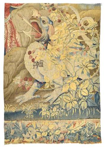 Tapestry fragment. Brussels, 16th century. 122 x 82 cm. This is a further piece of the tapestry fragment offered on the left. A dragon creature is depicted, with an inscription in black 