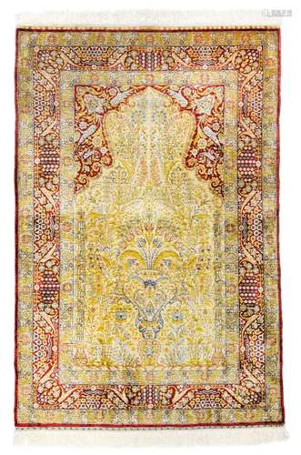 Hereke prayer in silk. Turkey, 20th century 150 x 100 cm. Fine floral and arabesque ornamentation, including branched forked vines, covers the 