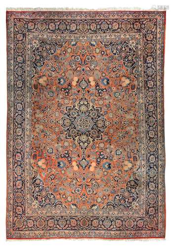 Keshan. Central Persia, c. 1930. 448 x 320 cm. Keschan typical of the region with ogival central medallion and classic colouring. The individual rose petal motifs in the field within the elegant palmette and floral vine work are to be highlighted. Provenance: From the dissolution of a North Rhine-Westphalian collection. - Insg. well preserved. Min. usessp.