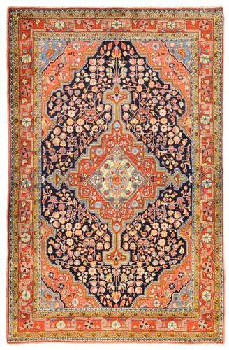 Djosan. Western Persia, circa 1940. 205 x 134 cm. Stylised floral tendril ornamentation with palmette and rosette blossoms covers the concentric base and the central, light red-ground medallion. The main border is dominated by a geometric and floral wavy vine. The partial 