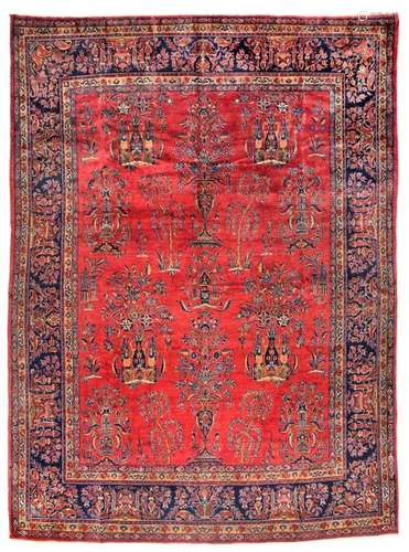 Manchester Keschan. Central Persia, c. 1930. 354 x 251 cm. A luxurious knotting work from the Keschan manufactories with a classic colour palette of shades with red, blue and cream accents. The red field is decorated with large bouquets of flowers and filigree vases. Such carpets, made of high-quality wool and with masterly composition, were mostly made for the international market. The beautiful corner solutions of the opulent dark blue main border with a design of magnificent bouquets are noteworthy. Provenance: South German private property. Acquired in the 1990s in German specialist shops. - Min. age-sp. insg. well preserved.