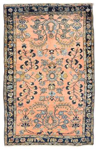 Sarouk. Western Persia, circa 1930. 187 x 122 cm. A good wool quality and especially the light salmon field colour distinguish this carpet. Floral decoration typical of the provenance in good colours in the field and border areas. Min. knotted. Ends newly chained. Insg. well preserved in the pile.