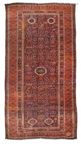 Beschir main carpet. Afghanistan, late 19th century. 400 x 210 cm. The elongated background is covered with a geometric variant of the 