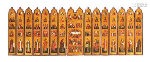 Folding conostasis (travel egg conostasis). Russia, late 19th century. 52 x 140 cm. Folding conostasis with fifteen individual panels connected by hinges with an ogival upper end. The central panel with a double-arched end shows the royal door with the four evangelists in the lower section, and the Annunciation and the Last Supper in the round-arched field above. The two picture fields above show the two high feasts of the crucifixion and the descent into hell of Christ. At the upper edge of the picture the Mother of God of the sign flanked by the Old Testament kings David and Solomon. The painting of each of the seven panels on the left and right of the central panel follows a symmetrical structure with five registers on top of each other. The prophets of the Old Testament are depicted from top to bottom, followed by two registers with the representation of male and female saints. The following register shows the high festivals of the Orthodox Church year. In the lower register the Mother of God and John the Precursor flanked by the Archangels Michael and Gabriel as well as Church Fathers and Hierarchs. Provenance: From a European royal house. Inherited in the family since the time of origin.