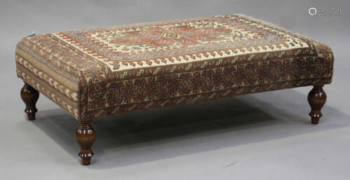 A modern rectangular footstool, upholstered in Turkish carpet, on turned feet, height 45cm, width